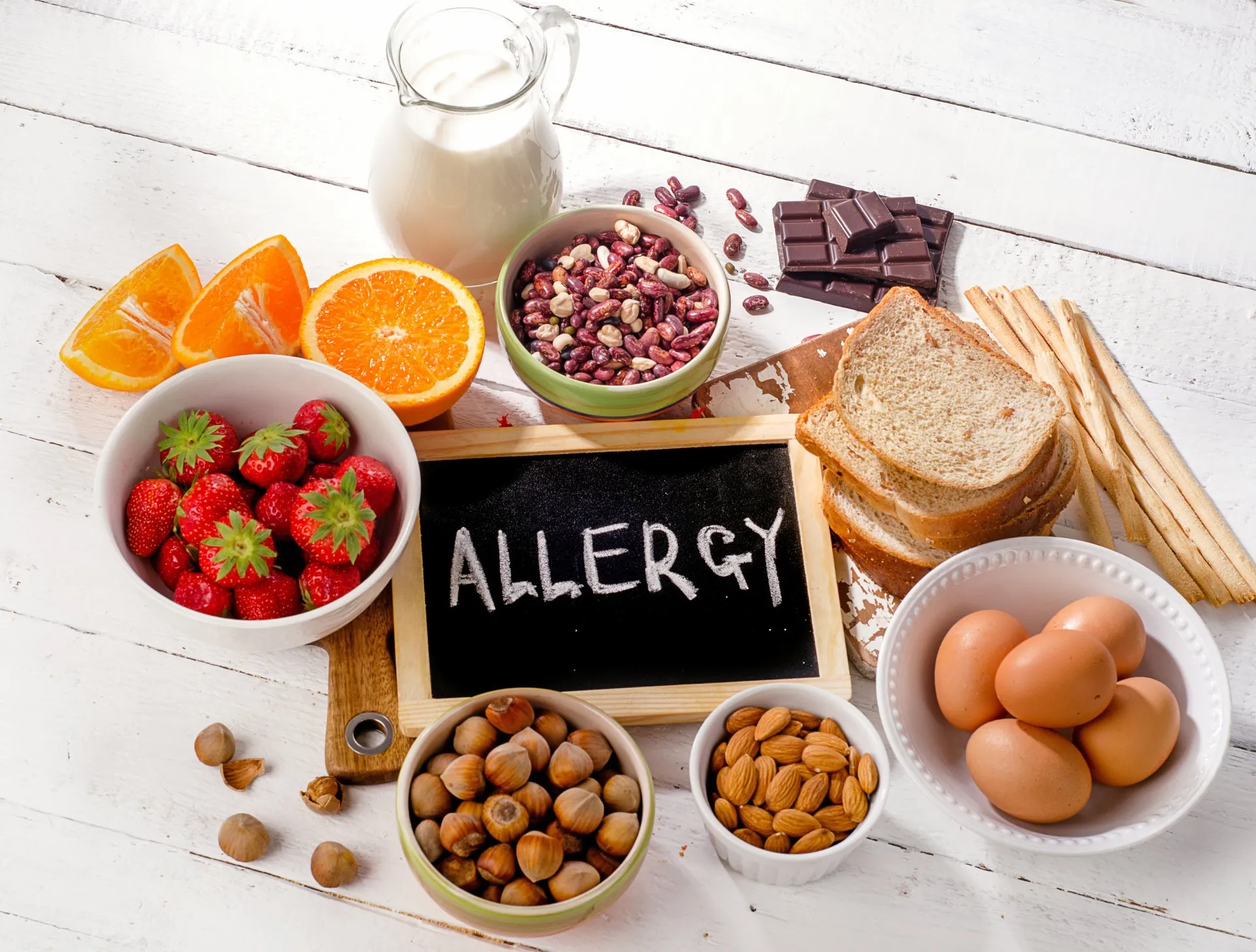Common food allergy ingredients arranged on a table